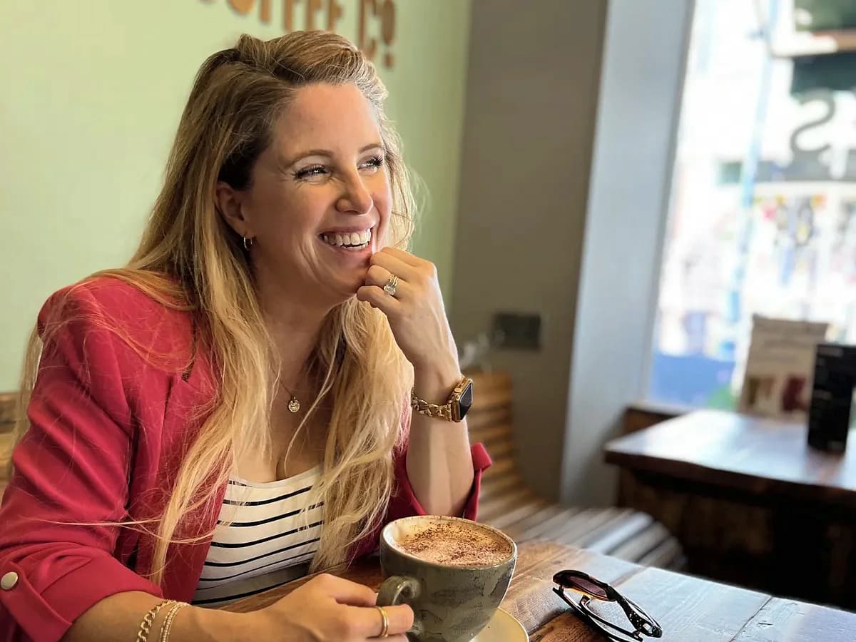 Rebecca Page laughing in a café